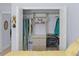 Open closet with custom shelving and rods providing ample storage space at 4878 Chitty Chatty Run, The Villages, FL 32163