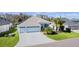 Well-maintained single-Gathering home with a three-car garage and manicured lawn at 4878 Chitty Chatty Run, The Villages, FL 32163