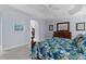 Relaxing main bedroom featuring a tray ceiling and decorative accents at 4878 Chitty Chatty Run, The Villages, FL 32163