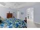 Spacious main bedroom with tray ceilings and ensuite bathroom access at 4878 Chitty Chatty Run, The Villages, FL 32163