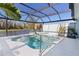 Beautiful pool and patio area with a serene waterfront view, perfect for relaxing and entertaining at 4878 Chitty Chatty Run, The Villages, FL 32163