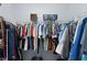Organized walk-in closet with ample hanging space and wire shelving for storage at 4878 Chitty Chatty Run, The Villages, FL 32163