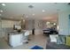 Open-concept kitchen and living area featuring modern design, stainless steel appliances, and stylish decor at 5023 Firebush Dr, Apopka, FL 32712