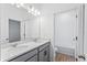 Bathroom with double sinks, and a doorway to the toilet and shower at 5107 Marshelder St, Apopka, FL 32712
