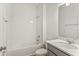 Bathroom featuring a shower and white tiled walls at 5107 Marshelder St, Apopka, FL 32712