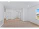 Spacious bonus room with plush carpeting, recessed lighting, and a window providing natural light at 5107 Marshelder St, Apopka, FL 32712