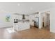 Modern kitchen boasting stainless steel appliances, a large island, and bright white cabinetry at 5107 Marshelder St, Apopka, FL 32712