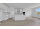 Bright, white kitchen featuring an island, stainless steel hood, subway tile backsplash, and modern appliances at 5155 Nickerbean St, Apopka, FL 32712