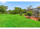 Spacious backyard features a screened-in lanai with an inground pool at 5235 Island Terrace Ct, Lady Lake, FL 32159