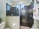 Bathroom showcasing a glass-enclosed shower with decorative tile at 5235 Island Terrace Ct, Lady Lake, FL 32159