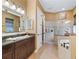 Bright bathroom with double vanity sinks, a soaking tub, and a separate shower at 5235 Island Terrace Ct, Lady Lake, FL 32159
