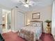 Bedroom showcasing closet and doorway to a bathroom at 5235 Island Terrace Ct, Lady Lake, FL 32159