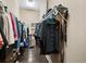 Walk-in closet with ample storage space and hardwood flooring at 5235 Island Terrace Ct, Lady Lake, FL 32159