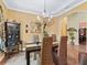 Cozy dining room with chandelier lighting, arched doorway, and views into adjacent rooms at 5235 Island Terrace Ct, Lady Lake, FL 32159