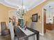 Dining room featuring neutral walls, tiled floors, a modern light fixture, and an open layout at 5235 Island Terrace Ct, Lady Lake, FL 32159