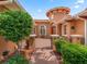 Elegant home featuring paver walkway, manicured bushes, and a decorative gated entrance at 5235 Island Terrace Ct, Lady Lake, FL 32159
