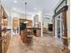 Open kitchen features a center island, tile floors, modern appliances, and breakfast bar at 5235 Island Terrace Ct, Lady Lake, FL 32159