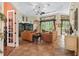 Spacious living room featuring tile floors, ceiling fan, and an open layout at 5235 Island Terrace Ct, Lady Lake, FL 32159