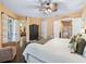 Bright bedroom with access to the back patio, Primary bath, and walk-in closet at 5235 Island Terrace Ct, Lady Lake, FL 32159