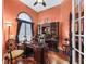 Office with hardwood flooring, large window, crown molding, and an executive desk at 5235 Island Terrace Ct, Lady Lake, FL 32159