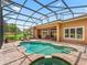 Enjoy the sparkling pool with a screened enclosure, perfect for outdoor relaxation and fun at 5235 Island Terrace Ct, Lady Lake, FL 32159