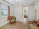 Bright sitting area featuring a window and view through to the bedroom at 5235 Island Terrace Ct, Lady Lake, FL 32159