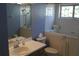 Comfortable bathroom with walk-in tub, tiled floors, decorative window, and modern fixtures at 5436 Astor St, Leesburg, FL 34748