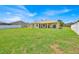 Spacious backyard featuring lush green lawn and a fence line at 5556 Vintage View Blvd, Lakeland, FL 33812