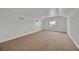 Bright, spacious bedroom with neutral carpet and ample natural light from a large window at 5556 Vintage View Blvd, Lakeland, FL 33812