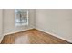 Cozy bedroom with hardwood floors and a bright window at 5556 Vintage View Blvd, Lakeland, FL 33812