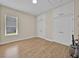 Bedroom with a large window, a closet, and wood floors at 5556 Vintage View Blvd, Lakeland, FL 33812