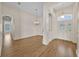 Open foyer with wood floors, chandelier, and decorative trim at 5556 Vintage View Blvd, Lakeland, FL 33812