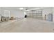 Spacious garage with white walls, a large door, and ample storage space at 5556 Vintage View Blvd, Lakeland, FL 33812