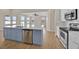 Bright, modern kitchen with white cabinetry, stainless steel appliances, and a stylish blue island at 5556 Vintage View Blvd, Lakeland, FL 33812