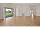 Bright living room boasts natural light, neutral walls, and hardwood floors at 5556 Vintage View Blvd, Lakeland, FL 33812