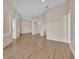 Spacious living room features hardwood floors, recessed lighting, and neutral color palette at 5556 Vintage View Blvd, Lakeland, FL 33812