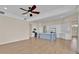 An open floor plan shows a kitchen and living area, with a large island and stainless steel appliances at 5556 Vintage View Blvd, Lakeland, FL 33812