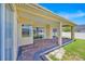 Covered brick patio with views of a fenced yard and neighboring house at 5556 Vintage View Blvd, Lakeland, FL 33812
