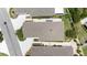 An overhead view displays the roof, landscaping, and driveway, showcasing the meticulous upkeep of the property at 579 Audrey Ln, The Villages, FL 32162