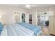 This spacious bedroom includes a view of the outdoor sunroom at 579 Audrey Ln, The Villages, FL 32162