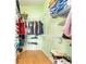 The walk-in closet has ventilated shelving and wood floors at 579 Audrey Ln, The Villages, FL 32162