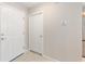 Hallway area featuring a closet and a secondary door in a home with tile floors at 579 Audrey Ln, The Villages, FL 32162