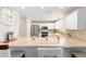 Bright kitchen featuring a breakfast bar and stainless steel appliances at 579 Audrey Ln, The Villages, FL 32162