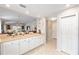 Open kitchen view showcases bright lighting, and a bar counter that flows into the entryway and living space at 579 Audrey Ln, The Villages, FL 32162