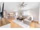 Open-concept living area showcases seamless transition to dining, flooded with natural light, and modern furnishings at 579 Audrey Ln, The Villages, FL 32162
