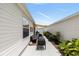 Backyard patio with outdoor seating, lush landscaping, and a serene atmosphere, creating a relaxing outdoor living space at 579 Audrey Ln, The Villages, FL 32162