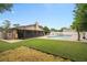 Well-maintained backyard with pool, screened patio, and lush green lawn at 721 Mendoza Dr, Orlando, FL 32825