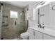Modern bathroom featuring stylish tiling, a glass shower, and a sleek vanity at 721 Mendoza Dr, Orlando, FL 32825