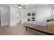Bright bedroom featuring a ceiling fan, neutral-toned flooring, and sliding doors to the pool area at 721 Mendoza Dr, Orlando, FL 32825