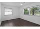 Bright bedroom featuring wood-look flooring, ample natural light and a modern ceiling fan at 721 Mendoza Dr, Orlando, FL 32825